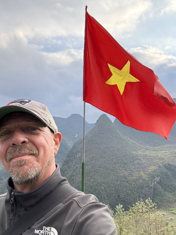Chad in the Vietnam mountains with the flag